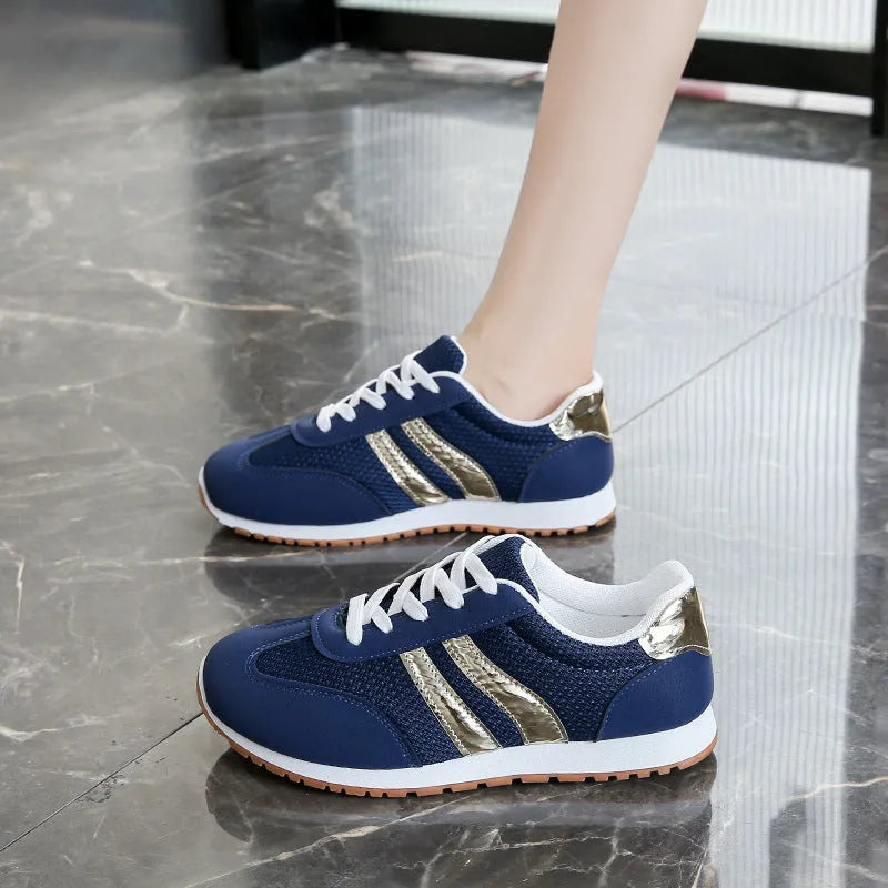 Blue women's casual tennis shoes with cross shoulder straps and rubber soles