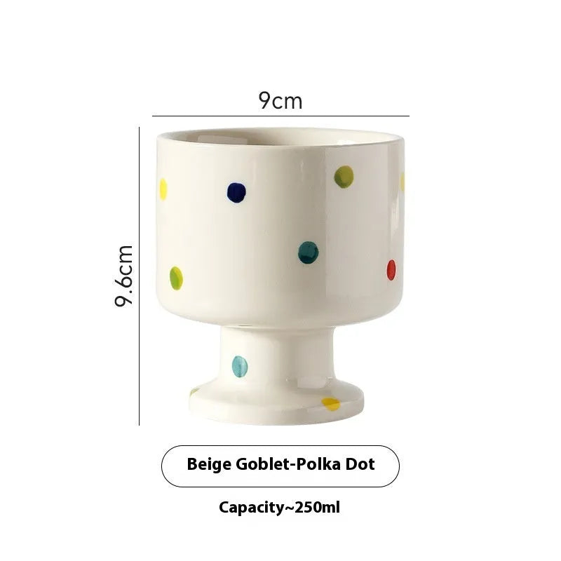 Hand-pinched irregular shaped ceramic mug in a solid colour, shown from the side.