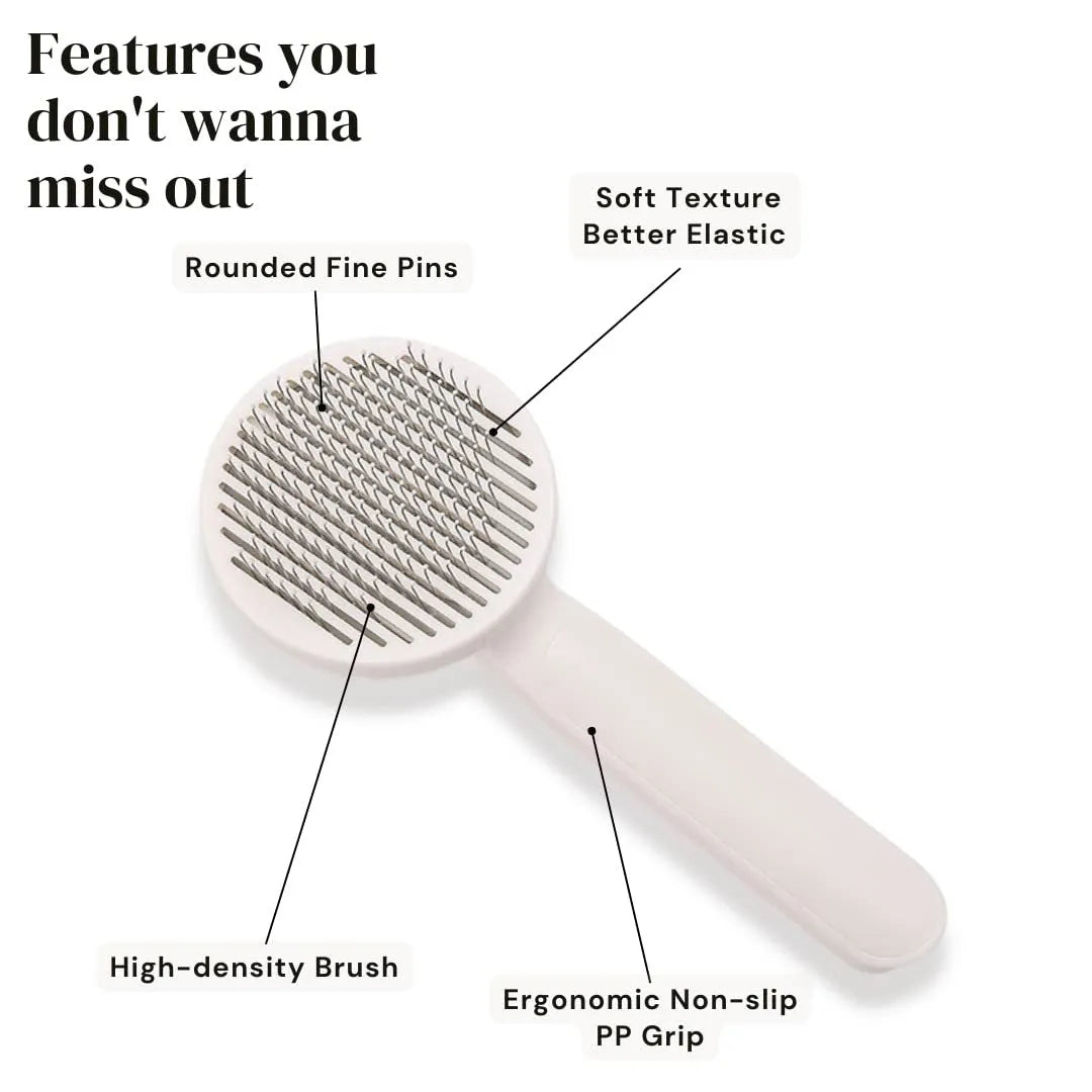 Blue self-cleaning pet grooming brush with rubber handle and stainless steel pins on a white background.
