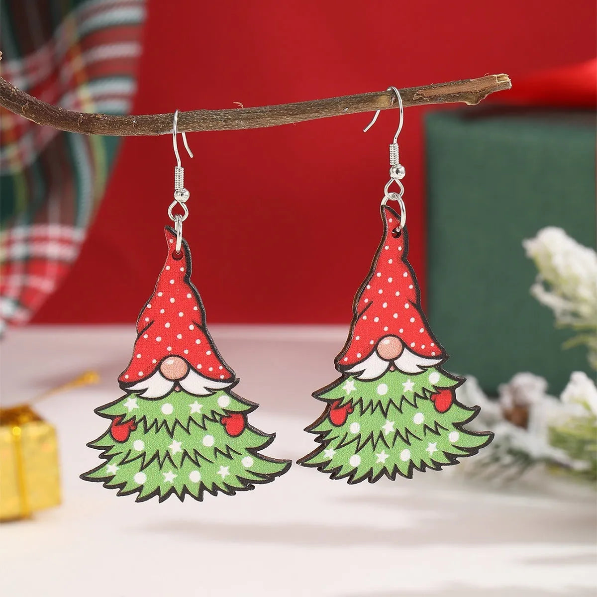 Women's wooden Christmas earrings with geometric tree and snowman shapes featuring Santa Claus elements