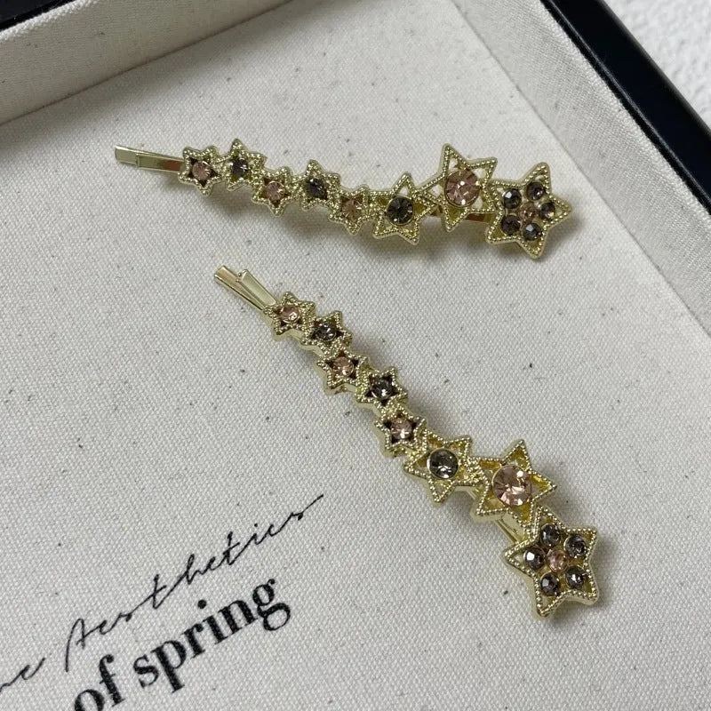 Gold rhinestone barrette with star design for clipping bangs and side hair