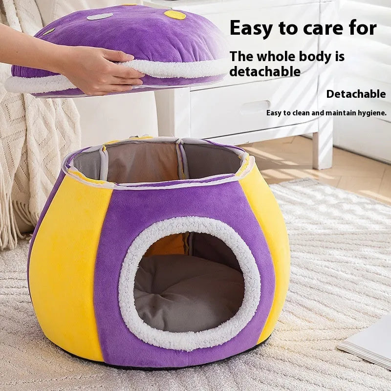 Purple mushroom-shaped plush cat nest bed for pets on a wooden floor