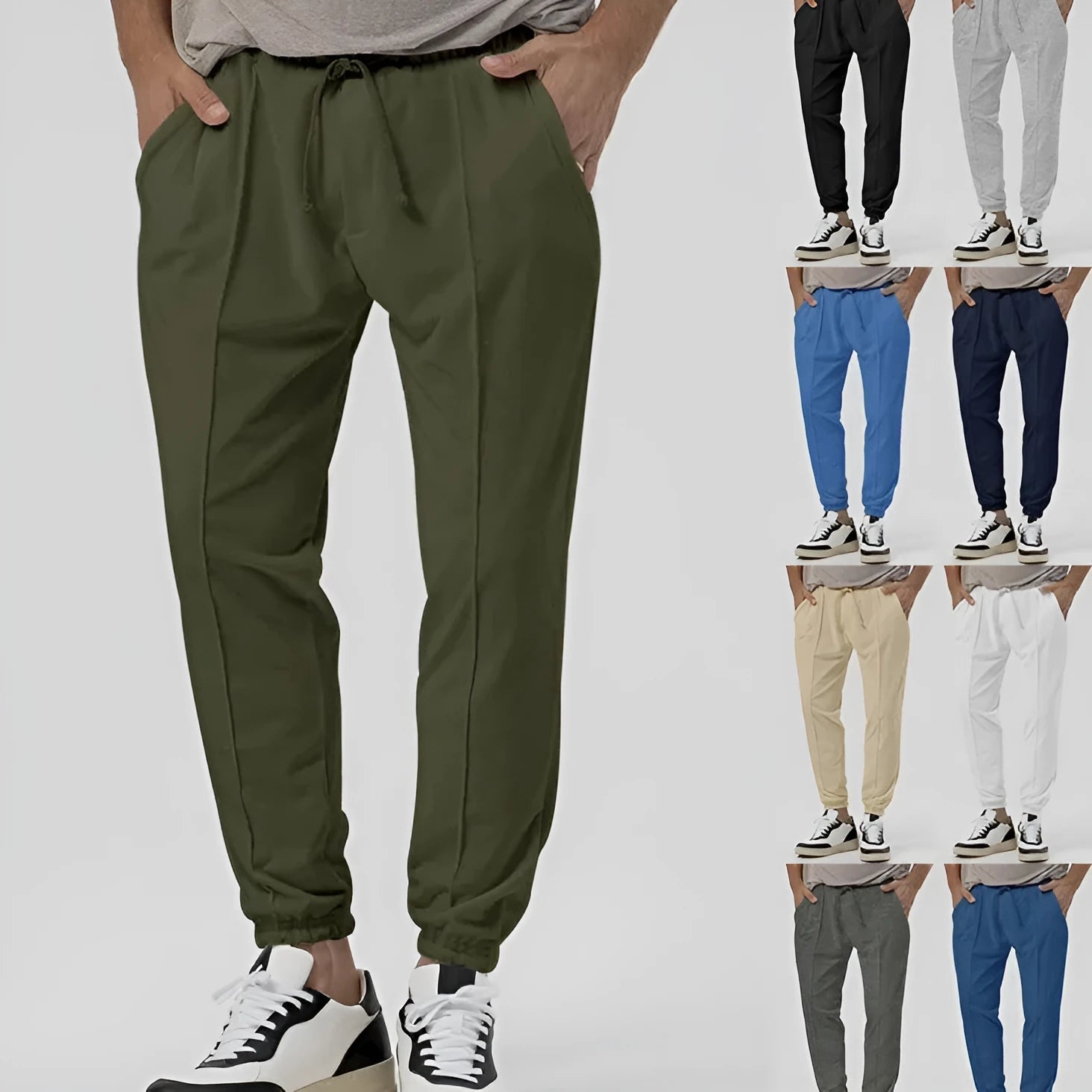 Men's grey casual track sweatpants with loose tapered cut and straight leg design, elastic waistband