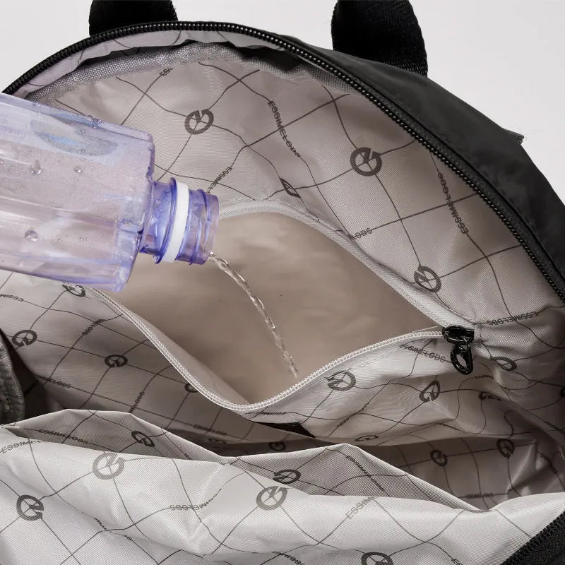 Outdoor lightweight backpack with nylon construction showing sandwich pocket design and available colour options