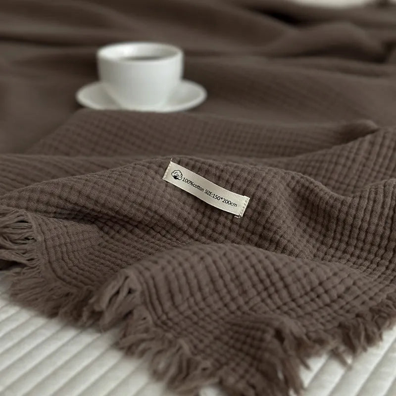 Four-layer gauze cotton blanket with tassel detailing in avocado green colour