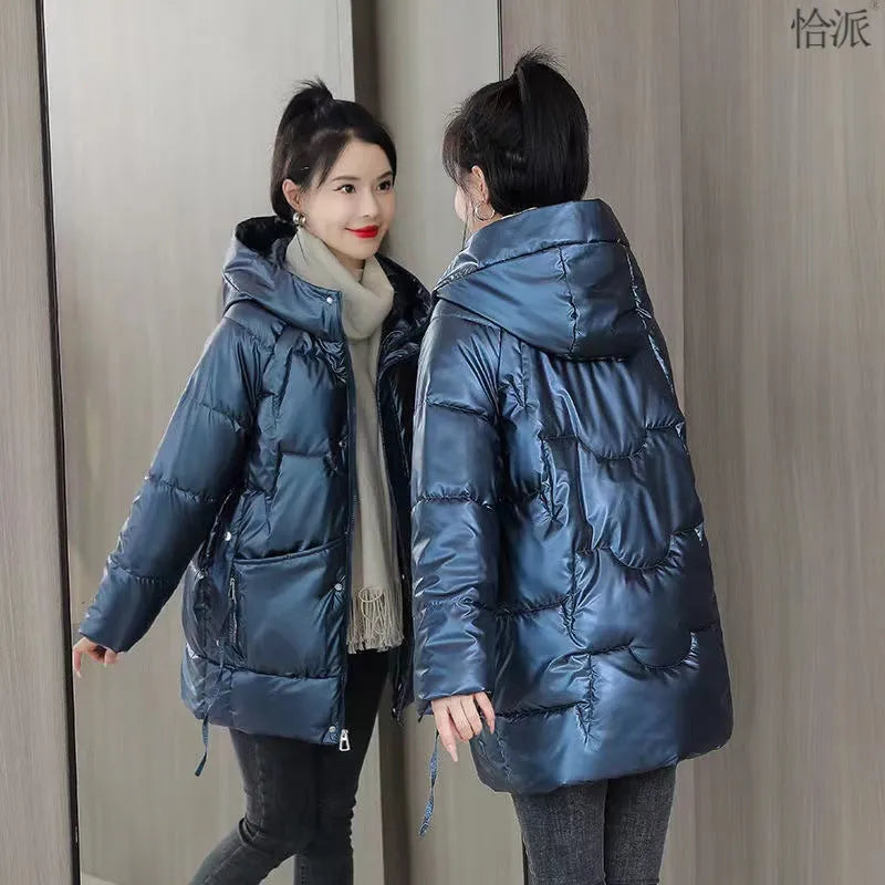 A women's loose-fit hooded winter jacket in a thick padded design, shown in one of four colour options.