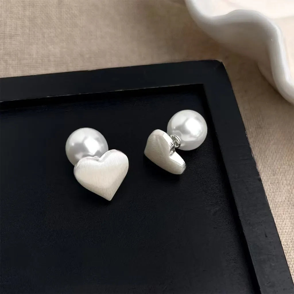 Love Pearl women's white pearl stud earrings with post-back fastening on white background