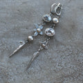 Hesheng geometric long pendant earrings with XINGX design and rhinestones in antique silver.