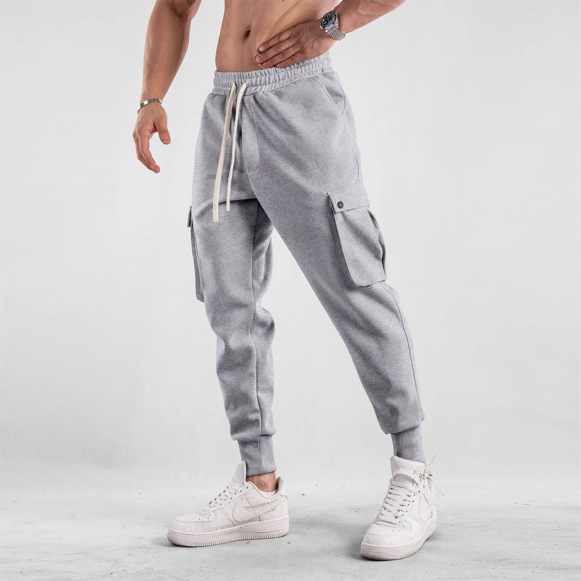 Men's loose cotton trousers with ankle tie fastening and multiple pockets in six colour options