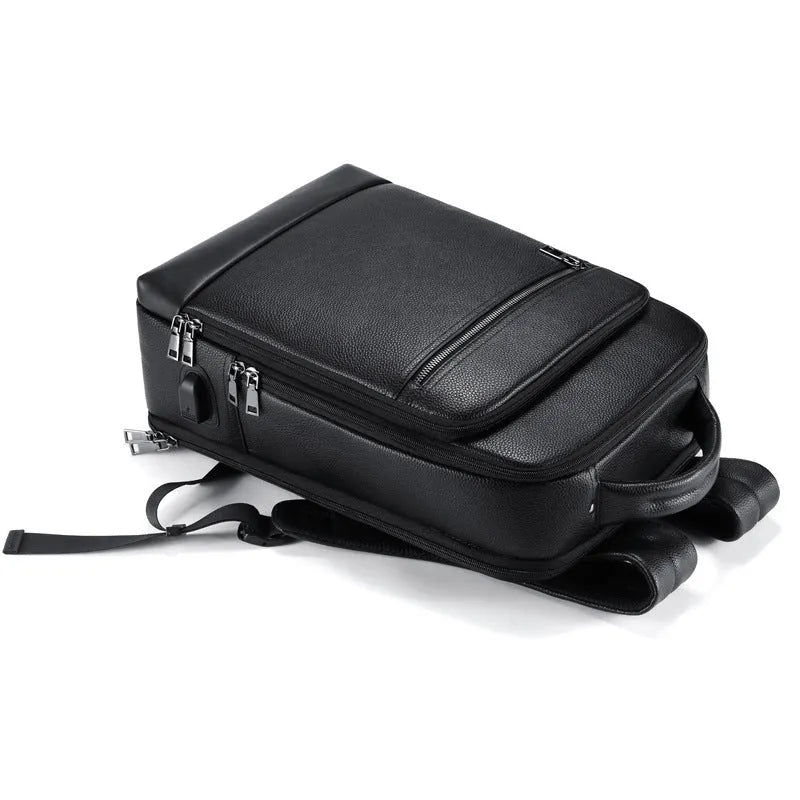Black genuine leather men's business backpack with curved shoulder straps and sewing line details