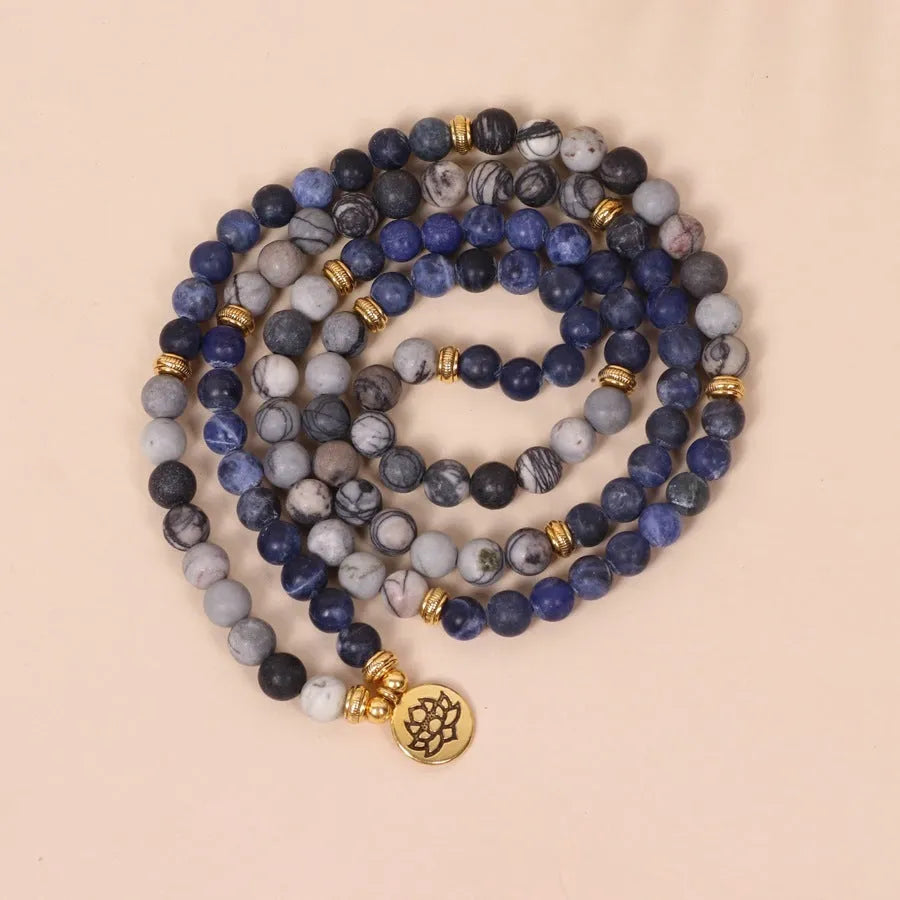 Blue patterned network stone beads on a multi layer alloy chain bracelet
