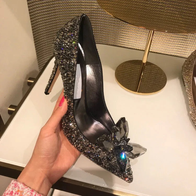 Women's gold high heels with pointed toes, rhinestone decoration, and stiletto heel