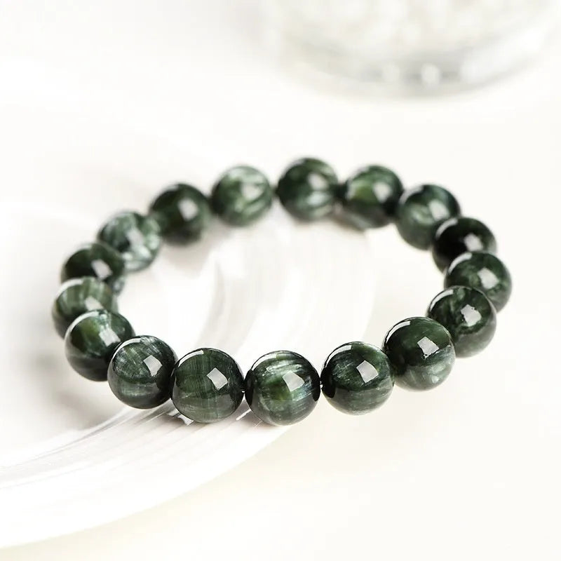 Green Dragon Crystal bracelet with 8-9mm round beads and geometry design featuring Ruyi elements