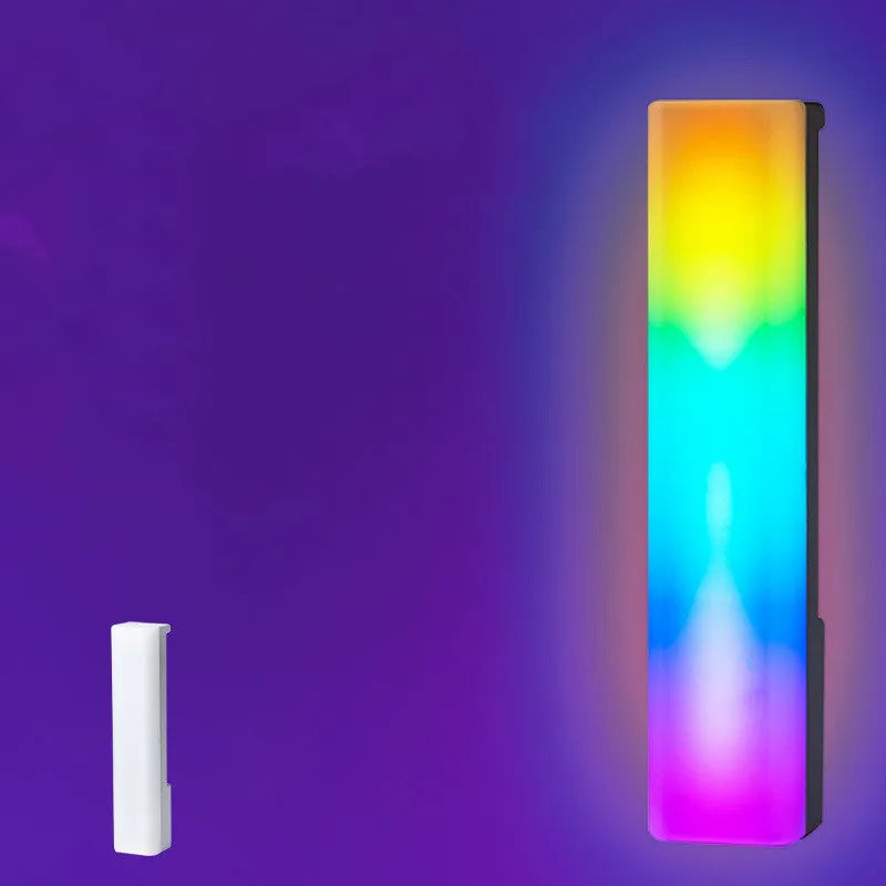 Black and white 3D RGB tabletop ambiance lamp with voice-activated rhythm lights for gaming and decor.