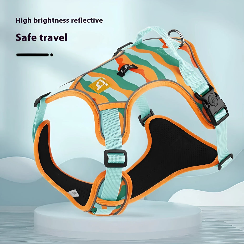 Orange reflective dog chest and back harness with an attached hand-holding rope on a grey background.