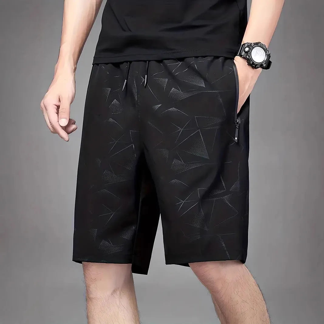 Men's loose fit sports shorts in polyester fabric available in black, grey and blue colours