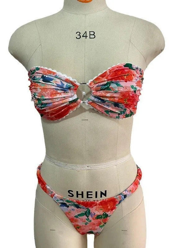 Blue floral print tube top bikini set with lace trim on a mannequin.
