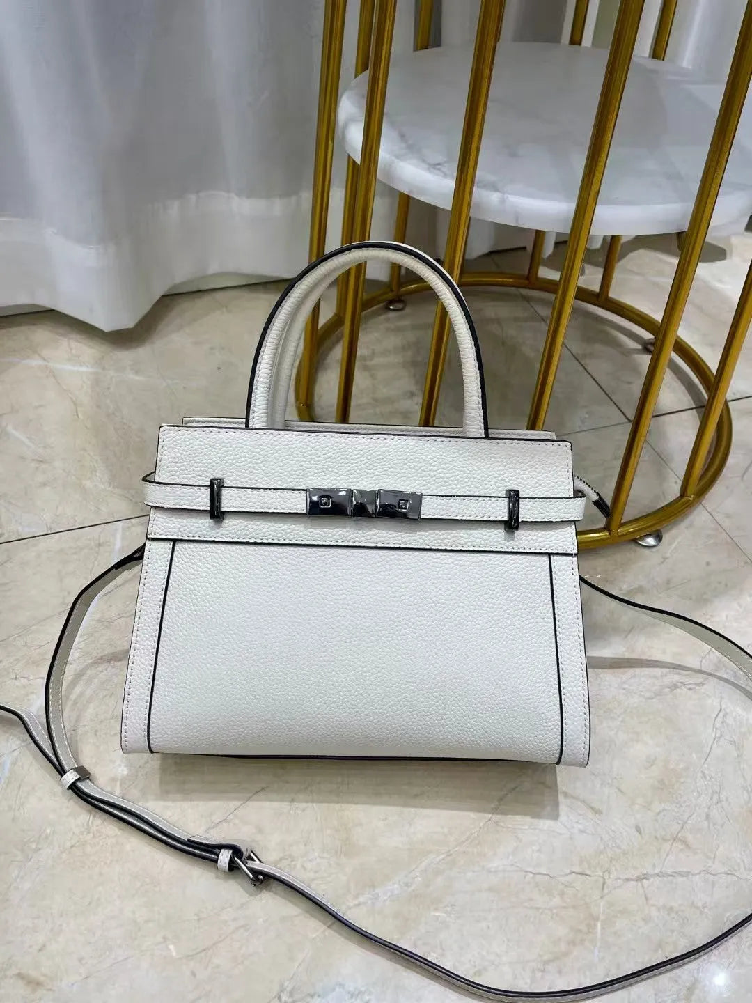Small square genuine leather shoulder bag in almond green with sandwich pocket exterior