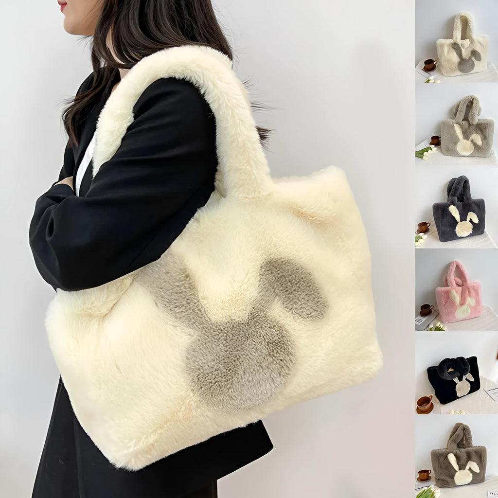 Soft plush shoulder bag with cartoon rabbit ears in one of six solid colours.