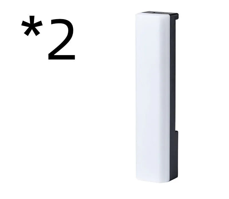 Black and white 3D RGB tabletop ambiance lamp with voice-activated rhythm lights for gaming and decor.