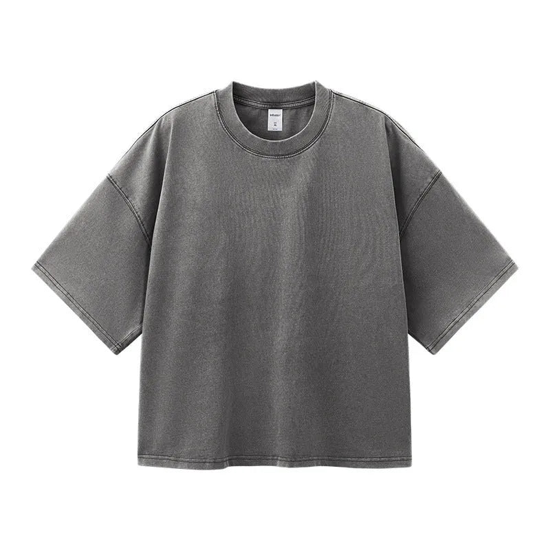 Men's loose vintage washed-out cotton t-shirt in khaki light colour, showing drop-shoulder sleeves and casual fit