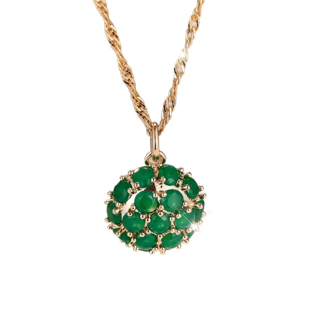 Round emerald and diamond pendant necklace in champagne gold colour on copper chain