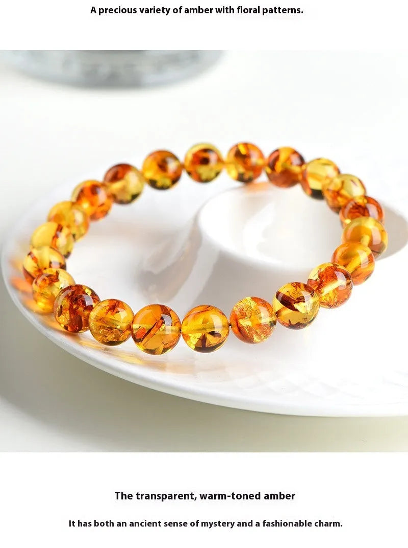 Natural yellow piebald amber bracelet with geometric design and polished Baltic amber beads