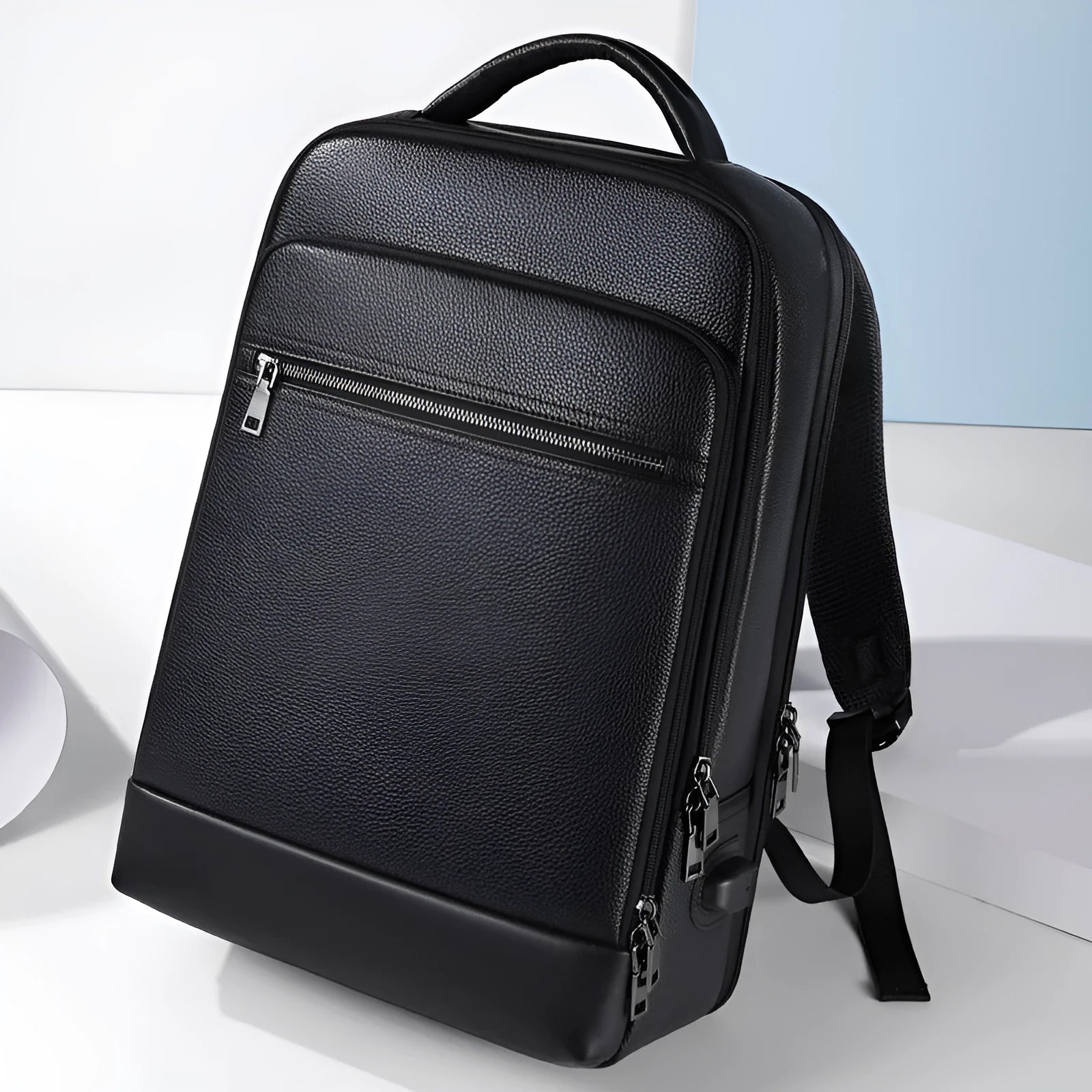 Black genuine leather men's business backpack with curved shoulder straps and sewing line details