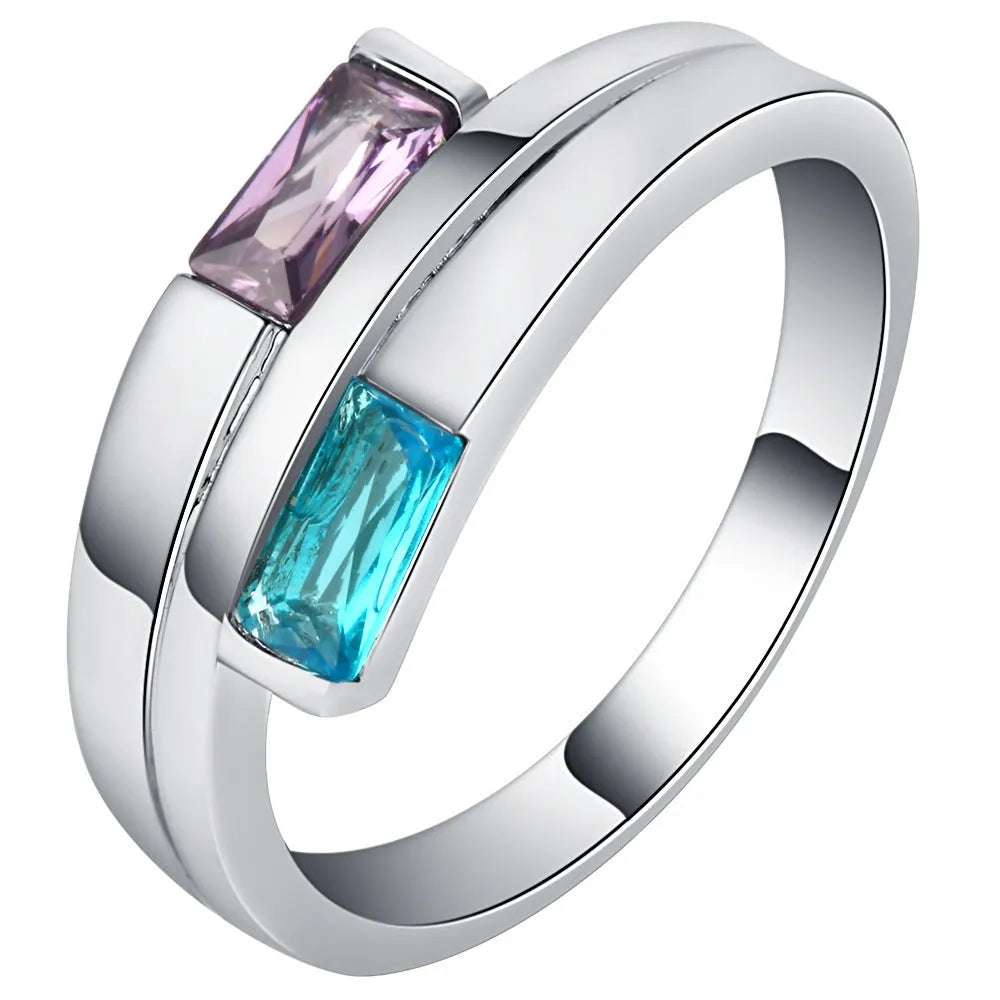 Silver electroplated copper ring with inlaid zircon details on a hand