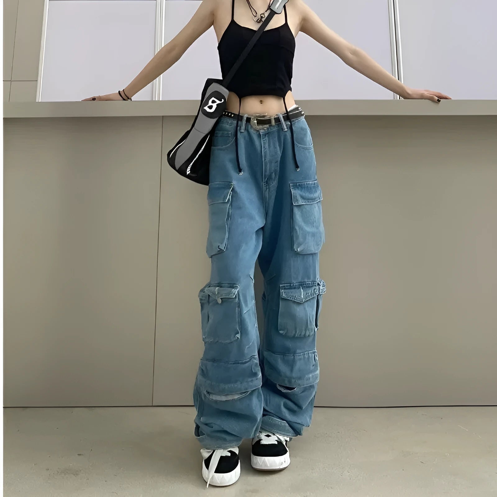 Women's high waist wide leg denim trousers with multiple pockets in tie-dyed blue colour