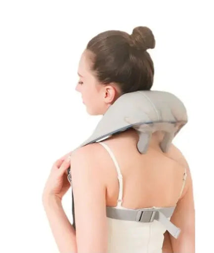 Creamy white rechargeable shoulder and neck massager on a plain background.