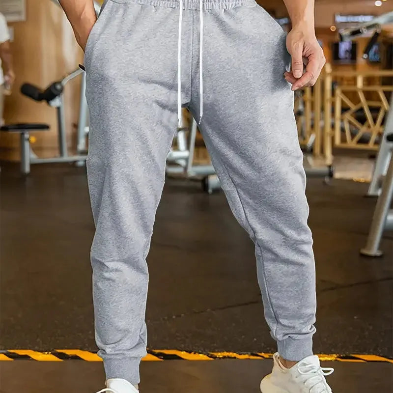 Men's linen-style leisure trousers with drawstring waist in loose fit casual design