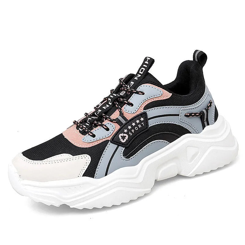 Women's white thick-soled casual sports shoes with mesh upper and buckle detail.