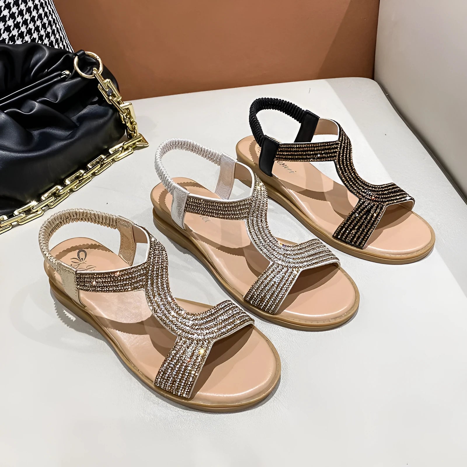 Women's patent leather beach sandals with rhinestone straps and non-slip soles in gold colour.