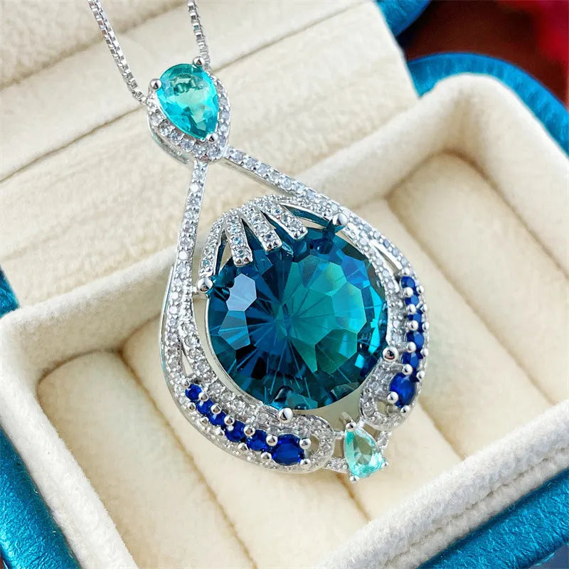 Blue geometric women's necklace with fireworks cut gems on water wave chain