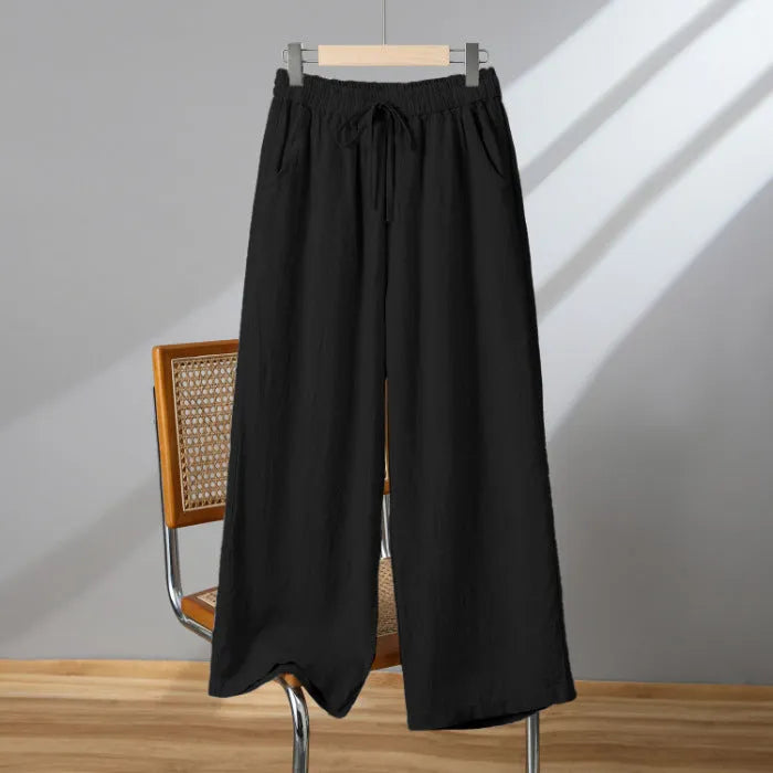 Women's straight-leg casual trousers in apricot colour with elastic waist and lace-up drawstring detail