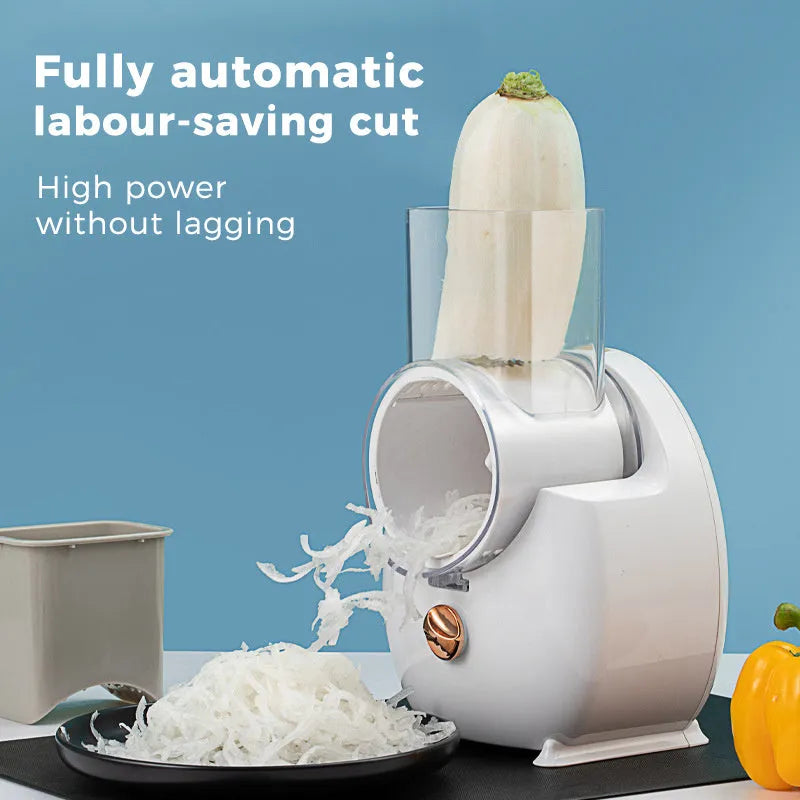 White electric vegetable slicer with rotary grater, feeding port, and strong suction base on a kitchen counter.