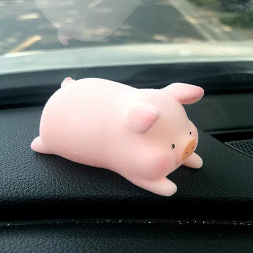 Cute cartoon pig resin figurine designed as a car dashboard decoration accessory.