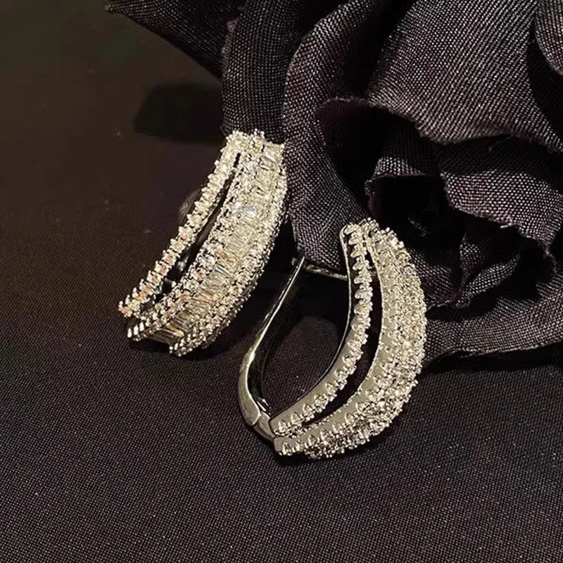 Geometric zircon stud earrings in white gold colour plating for women casual wear