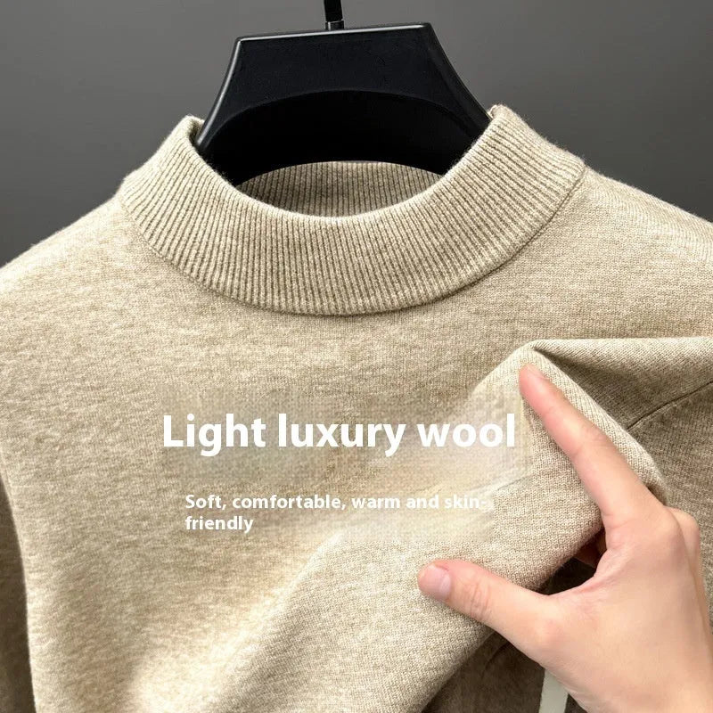 Men's solid colour fine yarn half-turtleneck long sleeve pullover on a hanger.