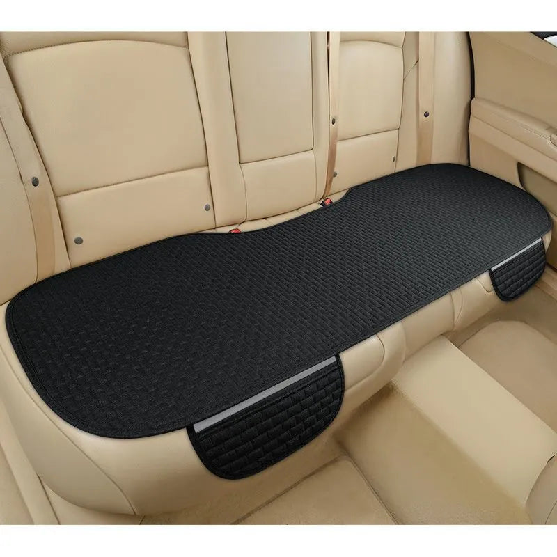 Linen car seat cushion in charm coffee colour showing hemmed edge detail