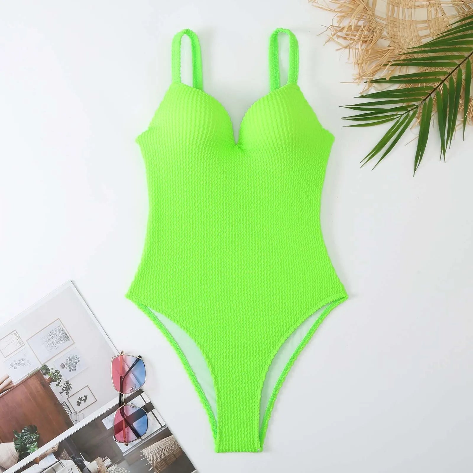 Women's black sunk-stripe one-piece swimsuit made from polyester fabric, sleeveless design.