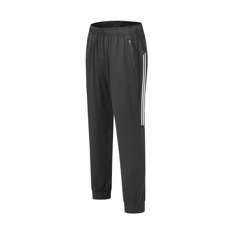 Men's black running trousers with mid waist and full length polyester construction for exercise