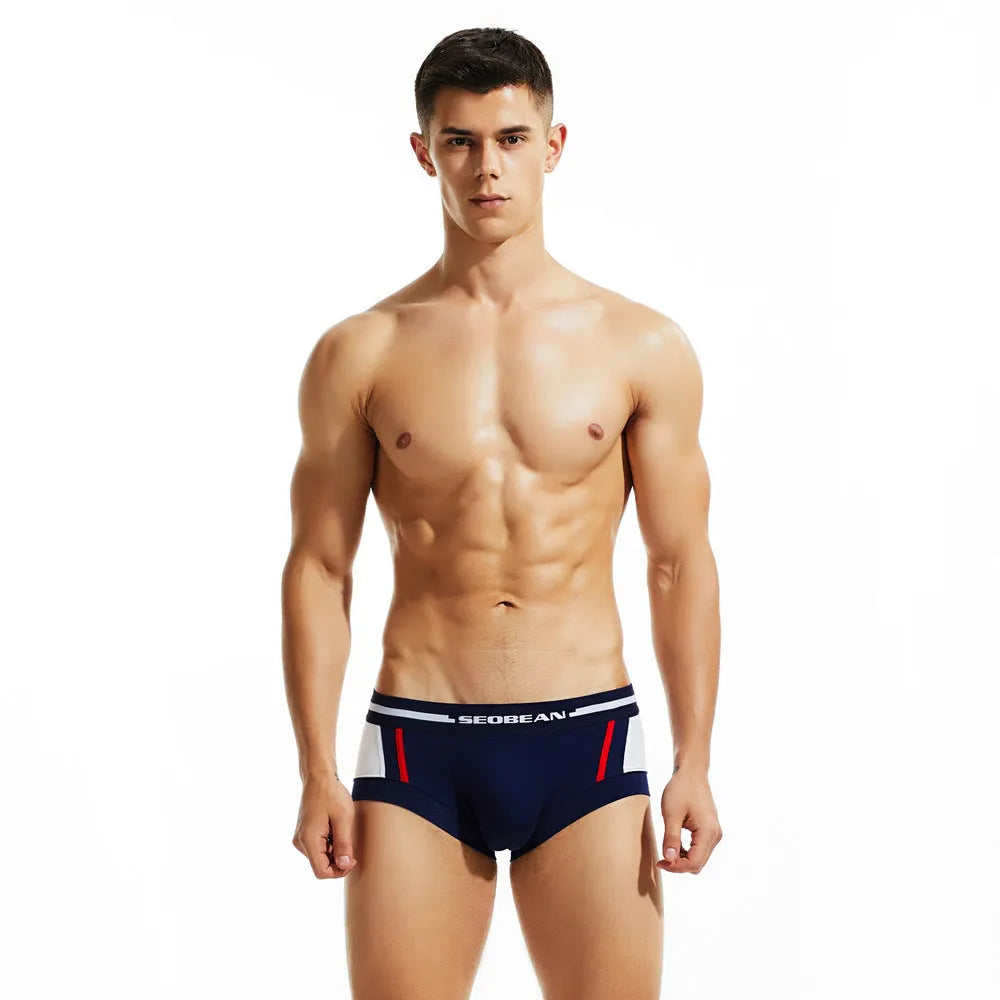 Men's cotton low-waist boxers in red, dark blue and light grey colours showing hip-lifting design