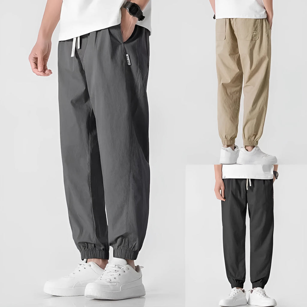 Men's fashion loose cuffed cargo pants in black, made from polyester, available in sizes S to 3XL.