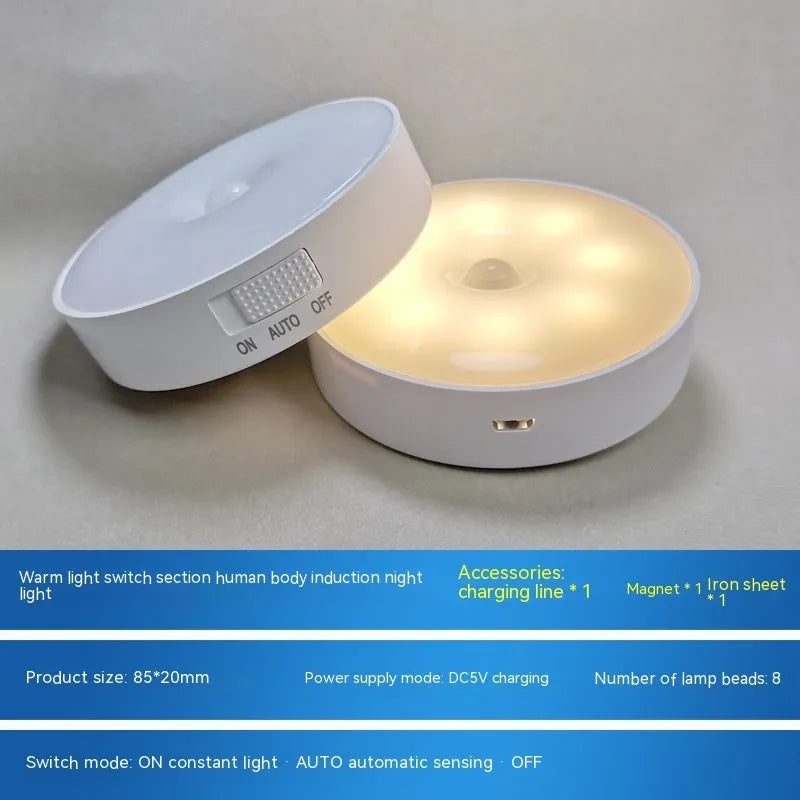 Compact beige motion sensing LED night light with USB charging port and adhesive backing