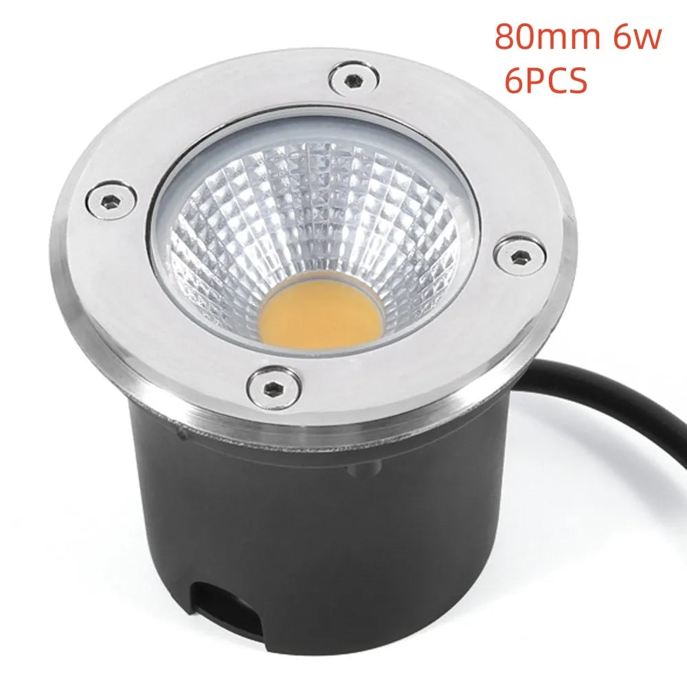 Black round LED COB underground light for outdoor garden and pathway illumination.
