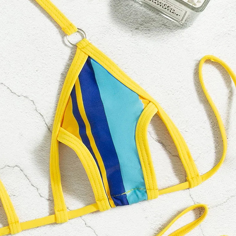 Yellow women's neck-hanging split swimsuit with backless design and high-waist shorts.