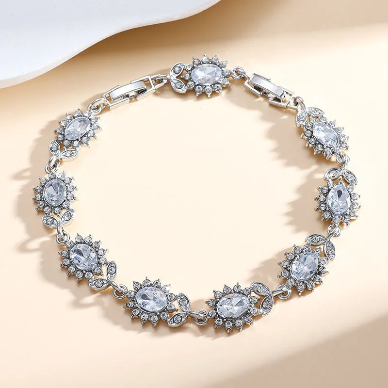 Women's bracelet with inlaid zircon gemstones in multiple colours on environmentally friendly alloy band