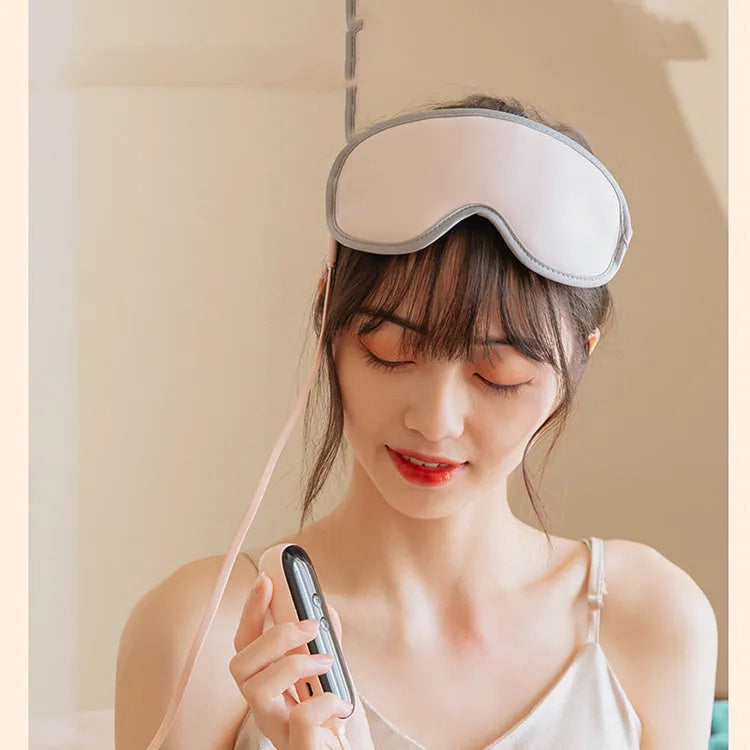 Portable eye SPA mask with steam and vibration massage functions in green or pink colours
